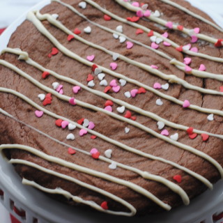 Brownie Cake Drizzled with White Chocolate and Heart Sprinkles